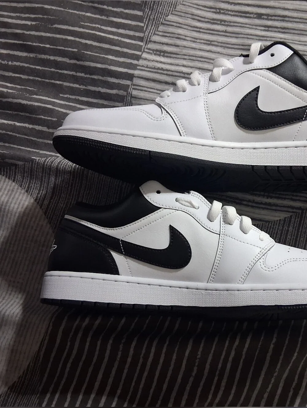 Jordan 1 Low-Top White Sneakers with Black Swoosh